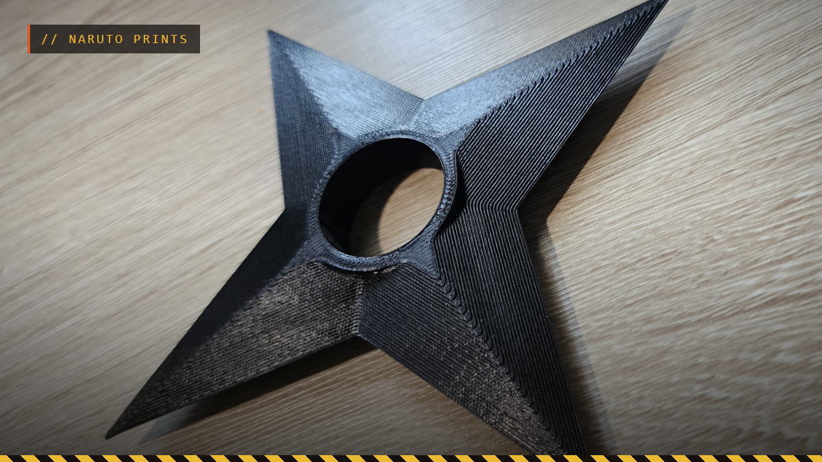 A 3D printed Naruto shuriken in black on a wooden table, by Triple G Workshop