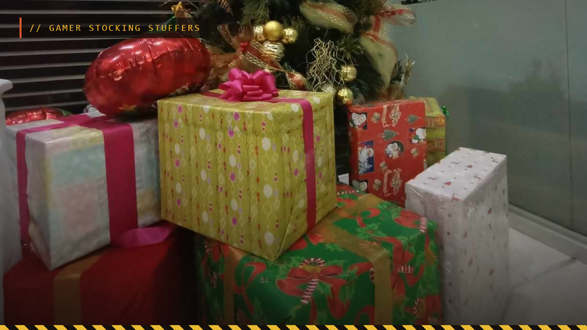 Wrapped Christmas presents under a decorated tree, gamer stocking stuffers header